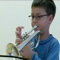 عکس 6 year old trumpet kid playing Handel