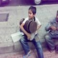عکس بدون شرح(تمبک نوازی پسر بچه در خیبانهای تهران)