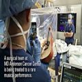 عکس Brain tumor patient plays guitar during awake craniotomy surgery