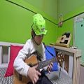 عکس While my guitar gently weeps - The Beatles (ukulele cover by 7year-old kid Sean