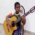 عکس نواختن آهنگ تایتانیک با گیتار توسط یک پسر ایرانی فوق العاده زیبا