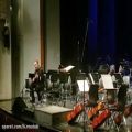 عکس تکنوازی کیوان ساکت در اجرای ارکستر ملی ایران