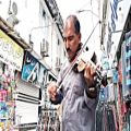عکس تکنوازی زیبا از استاد حسین میرشکاری در بازار روز چالوس (کلیپ رحمان)