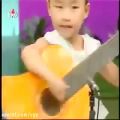عکس *****نواختن گیتارتوسط کودکان کره شمالی****