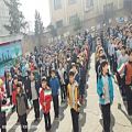 عکس سرود دسته جمعی دانش آموزان دبستان پسرانه