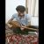 عکس دوتار زدن محمد امین عابد و خواندن موسیقی محلی